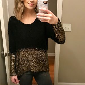 Francesca’s black and gold sweater